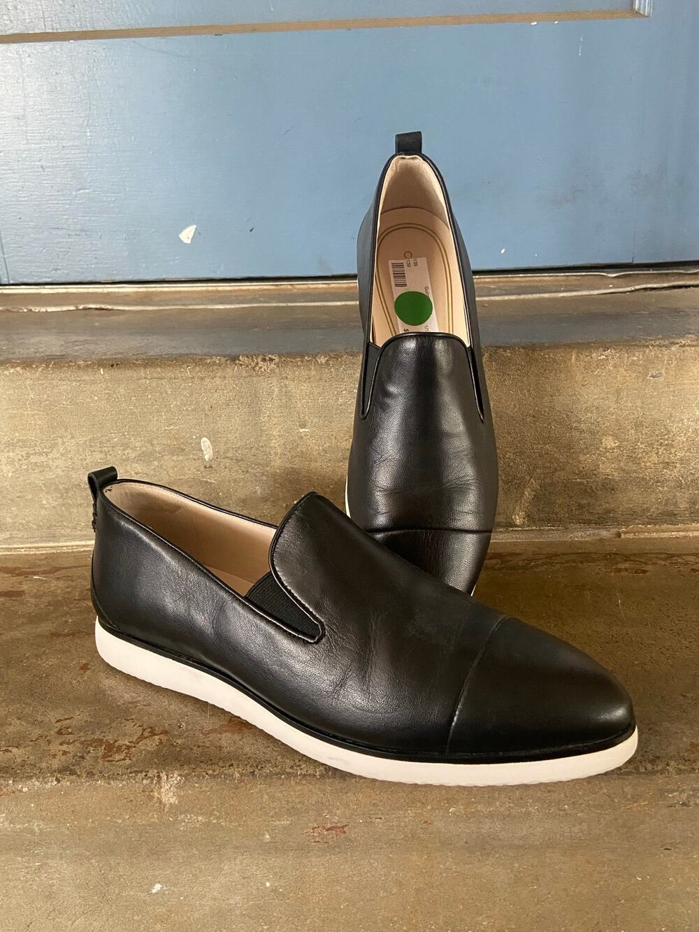 Cole Haan black leather almond toe slip on loafer wirh white outsole
